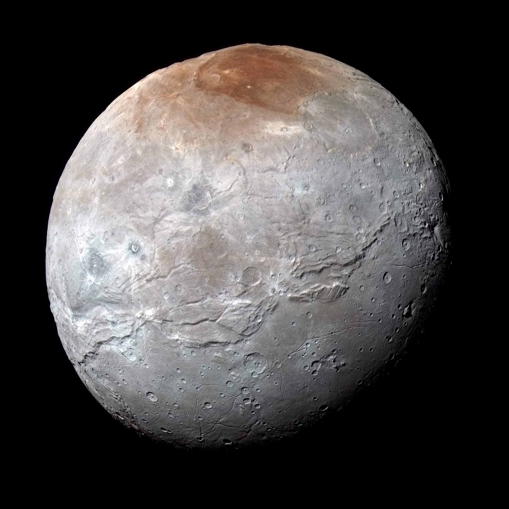pluto paints its largest moon red nasa