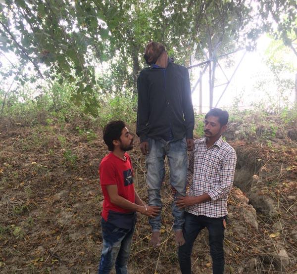 hanged by a tree  the young man has been hanged