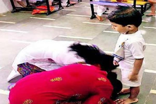 teacher touch student feet in rushikul gurukul school