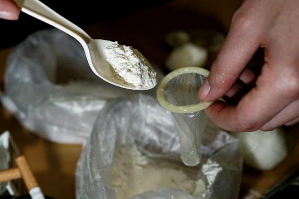 man tries to smuggle heroin by condom filled with the drug