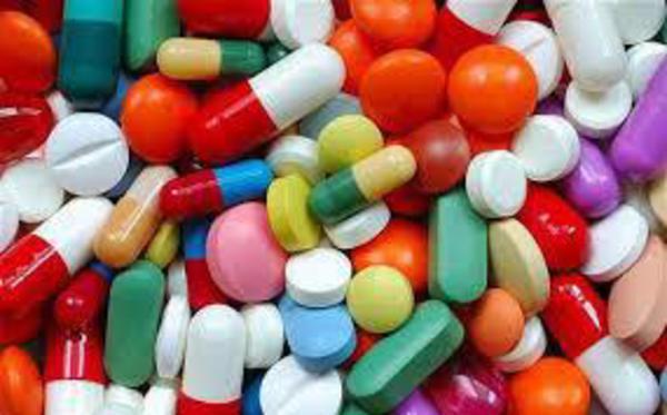 scrap  drug pills and liquor recovered