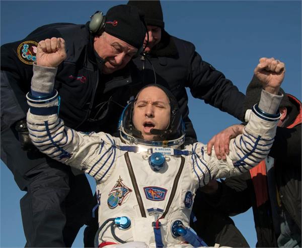 two astronauts  cosmonaut return from five month iss mission