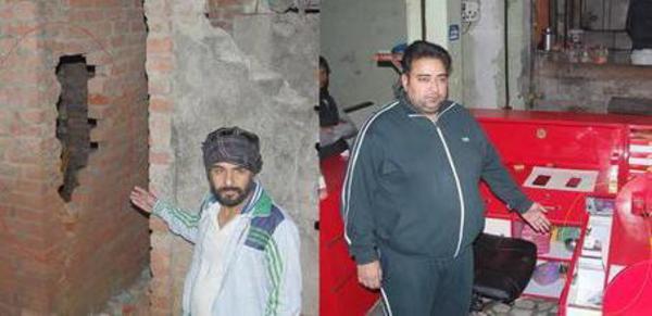 cash stolen by dividing the wall of a sweet shop