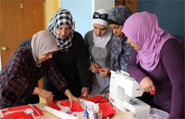 syrian women in peterborough say thank you with hand sewn canadian flags