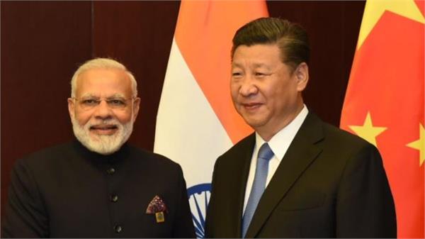 pm modi meets china s xi jinping ahead of sco summit in astana