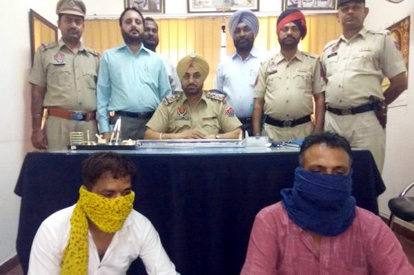 two arrested  including a scam