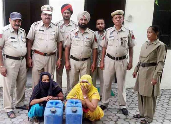 two women  including illicit liquor  were arrested