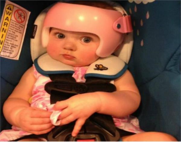 each member of the family puts helmets 
