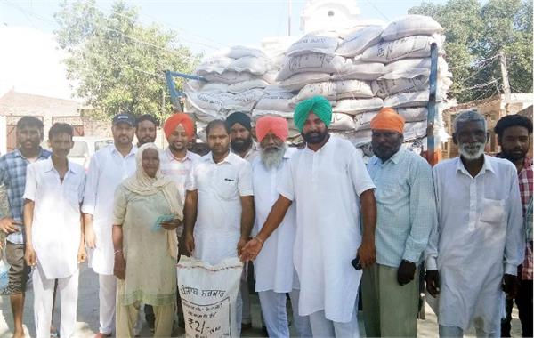 under the atta dal scheme  distributed cheaper wheat to the people of jhabal