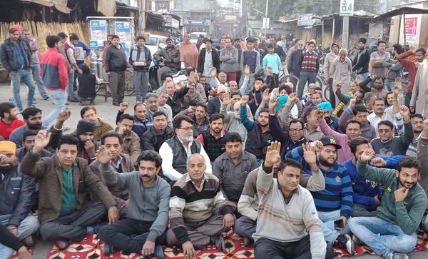 shopkeepers at the municipal corporation face to face