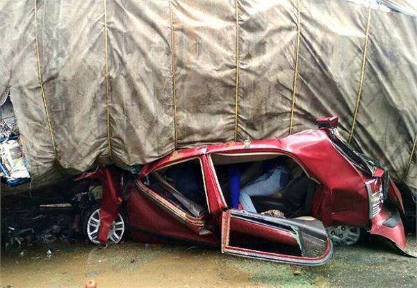 overload truck overturned on car due to uncontrolled