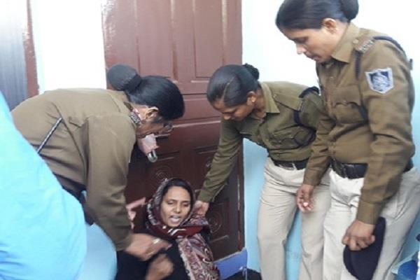 woman sitting out of in laws for justice