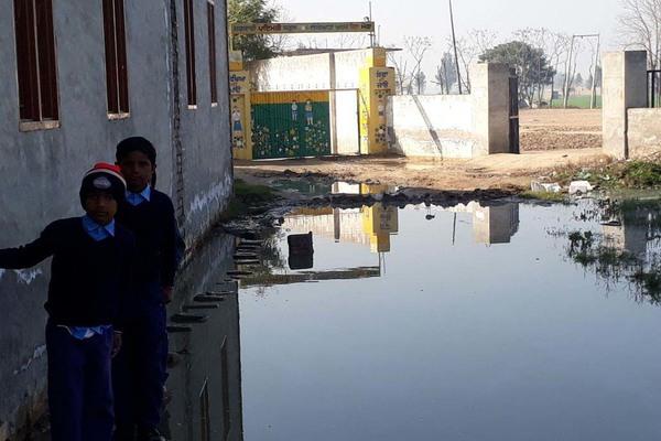 the dharna given by the people standing by the water at the school