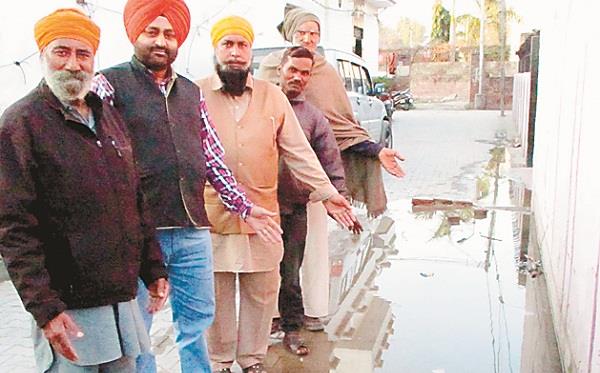 disturbed water standing in the streets due to sewerage jam