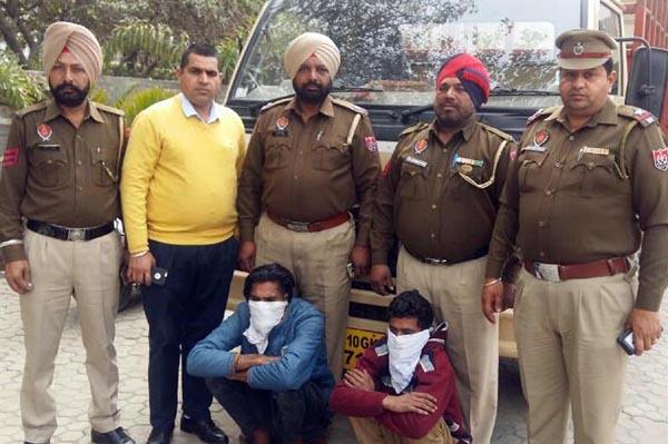 100 bottles of liquor  two detained  including canter