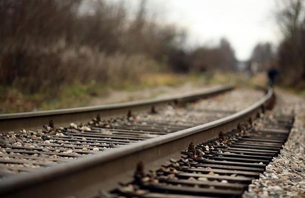 suicide by a young man jumping ahead of train