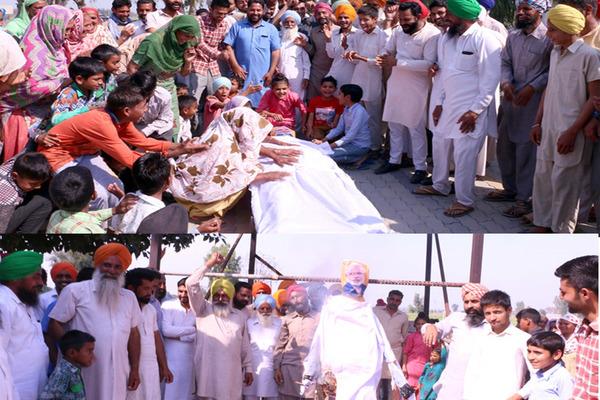 farmers blame prime minister  s effigy