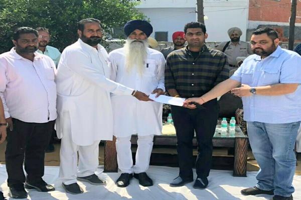 a check of rs 1 14 crore received by rural panchayats