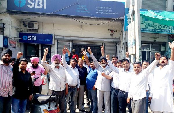sloganeering by businessmen unhappy with attitude of bank employees