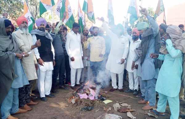 palladarars protest against the government by burning copies of the policy