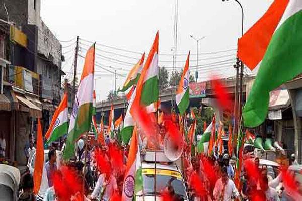youth on the road with the tri color in the memory of the martyrs
