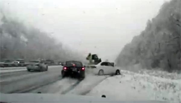 police officer s miracle escape after hit car icy road in us