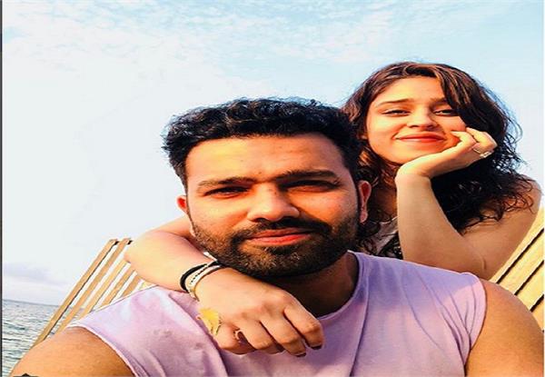 this beautiful picture with his wife rohit resting after the sri lanka tour