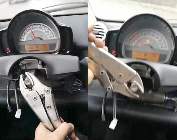 car has no steering wheel so man drives it using a wrench