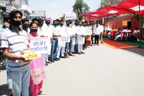 political   warrior   in front of a hunger strike    weapon of hunger    and   dhar  