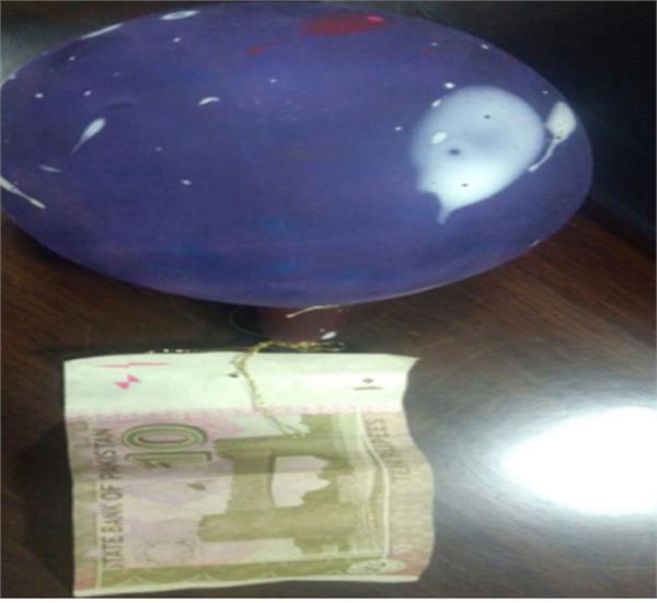 pakistani note and balloon found