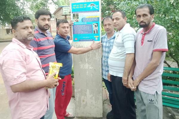 youth welfare club puts awareness posters on dengue