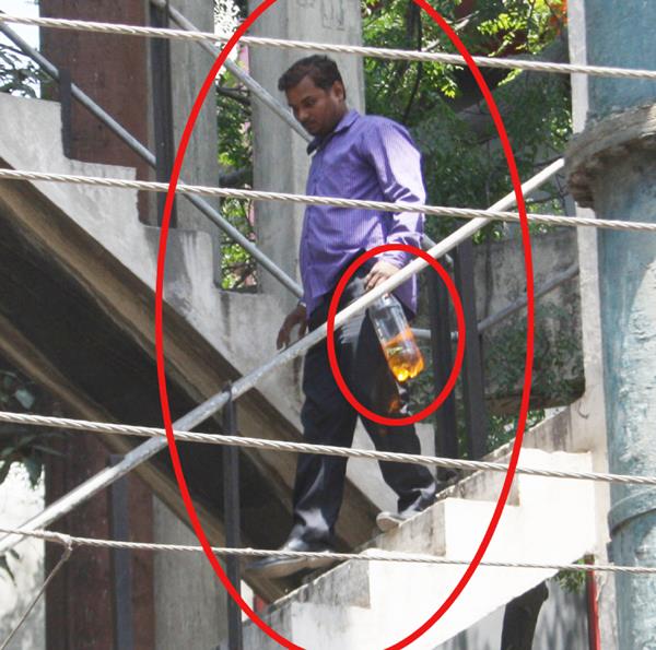 the miserable young patrol bottle carrying the bottle and climbing on the tanks