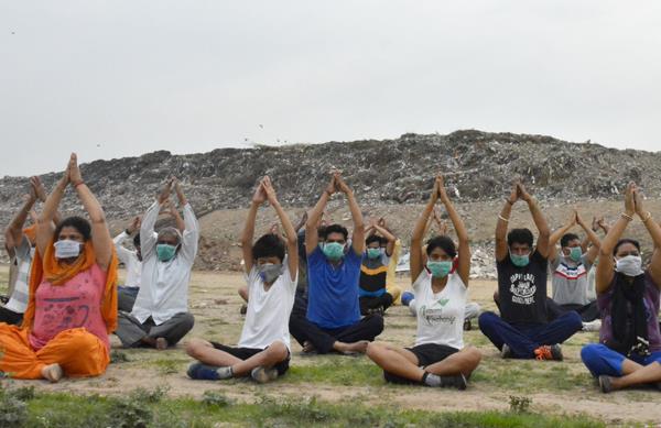 dumping ground  in dudu mazara  wearing a bandage on the mouth