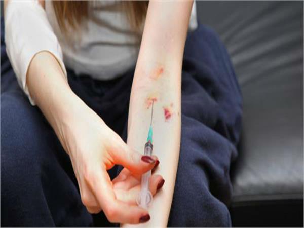 woman arrested for injection