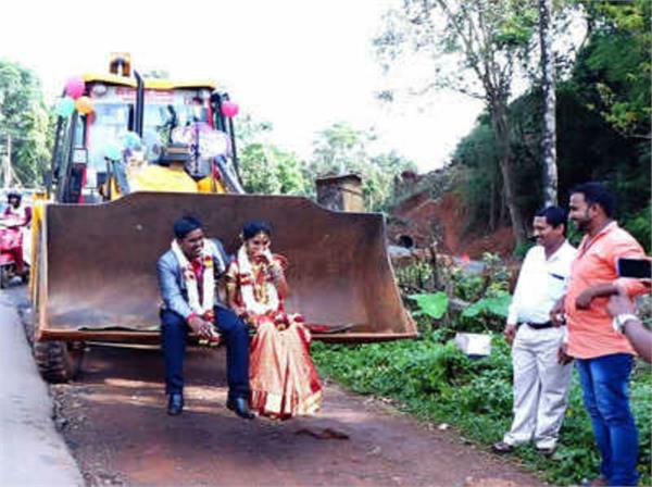 bridegroom took the bride in the jcb machine