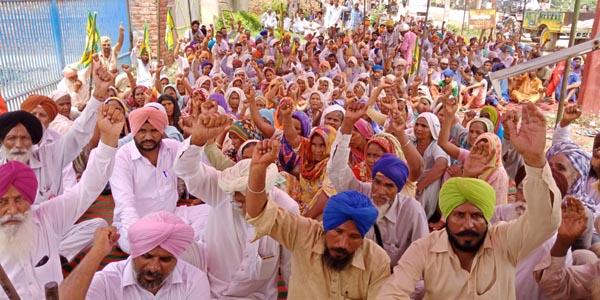 farmers and laborers planted in front of factory