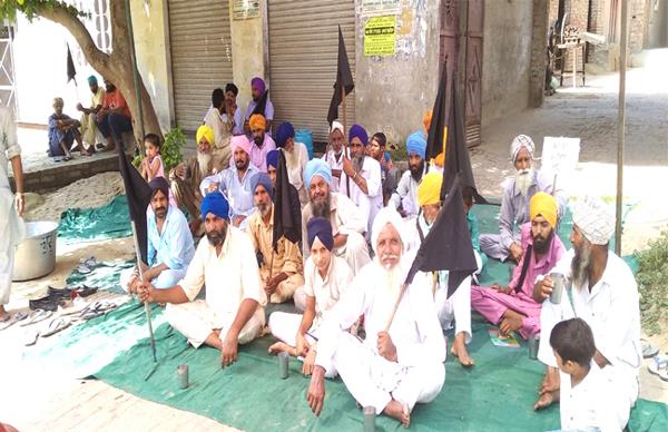 dhalla people put dharna at some distance