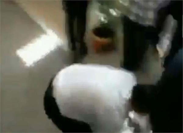 professor touches abvp office bearers feet