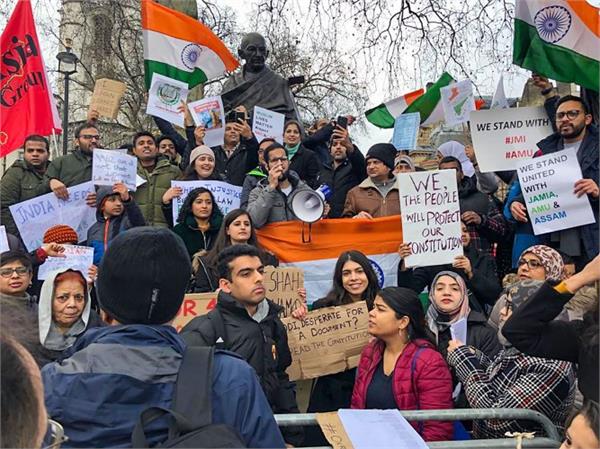 gandhi statues gathered in london in protest against caa