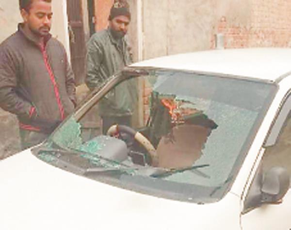 unidentified men stand a glass of glass outside the house