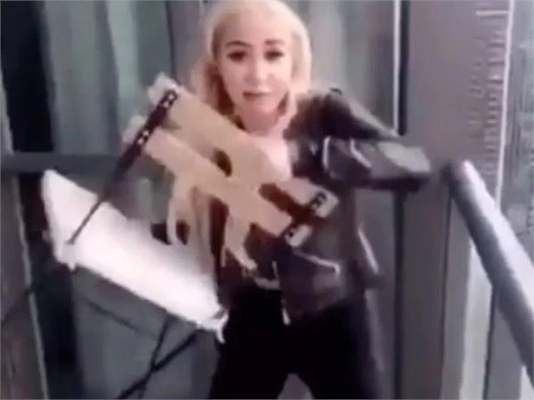 toronto police investigating video of woman throwing chair off condo balcony