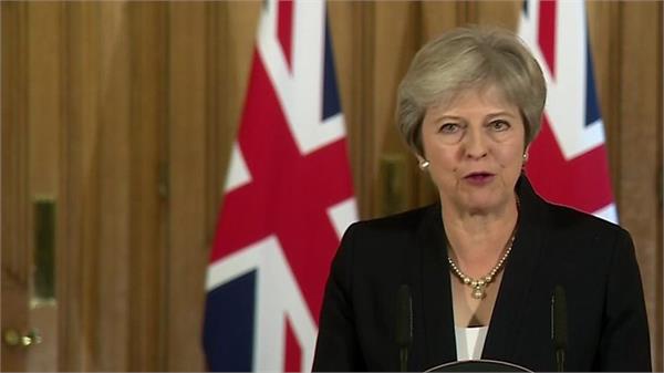 theresa may insists she will deliver brexit on time