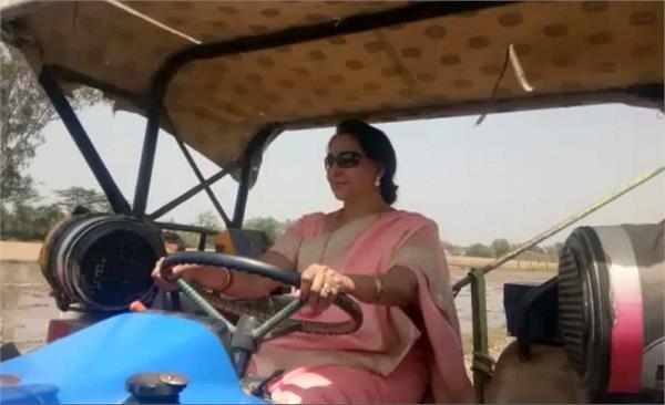 bjp mp hema malini drives tractor