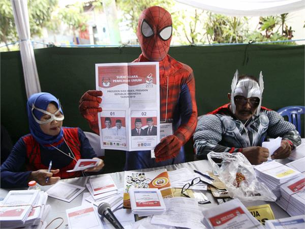 see spiderman  captain america  arrive for voting in indonesia elections