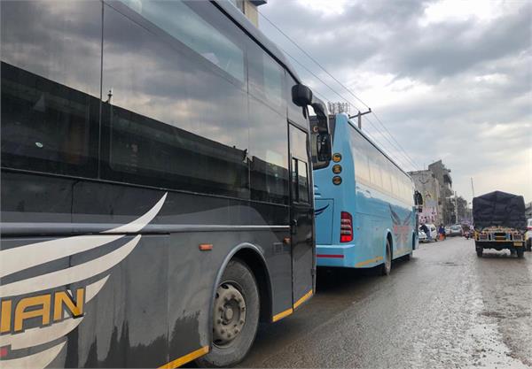 indo canadian buses are being middle of the road