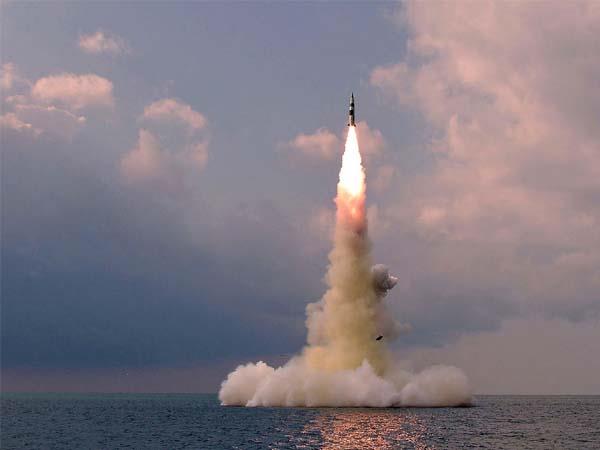 north korea fires 23 missiles  air strike alert on south korean island