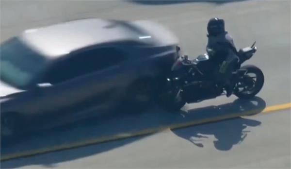 biker collided into car in police chase