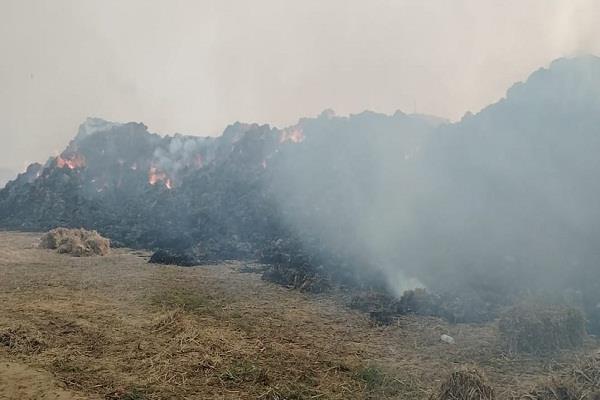 fire breaks out in a straw bale dump