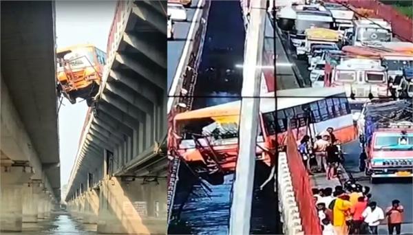 roadways bus full of passengers hangs on bridge
