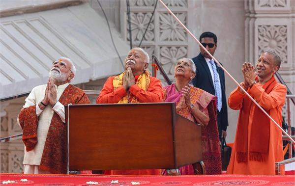modi hoists religious flag at ram temple